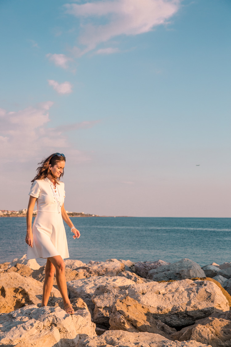 walking on the stone wall next to Paphos Harbour, Cyprus