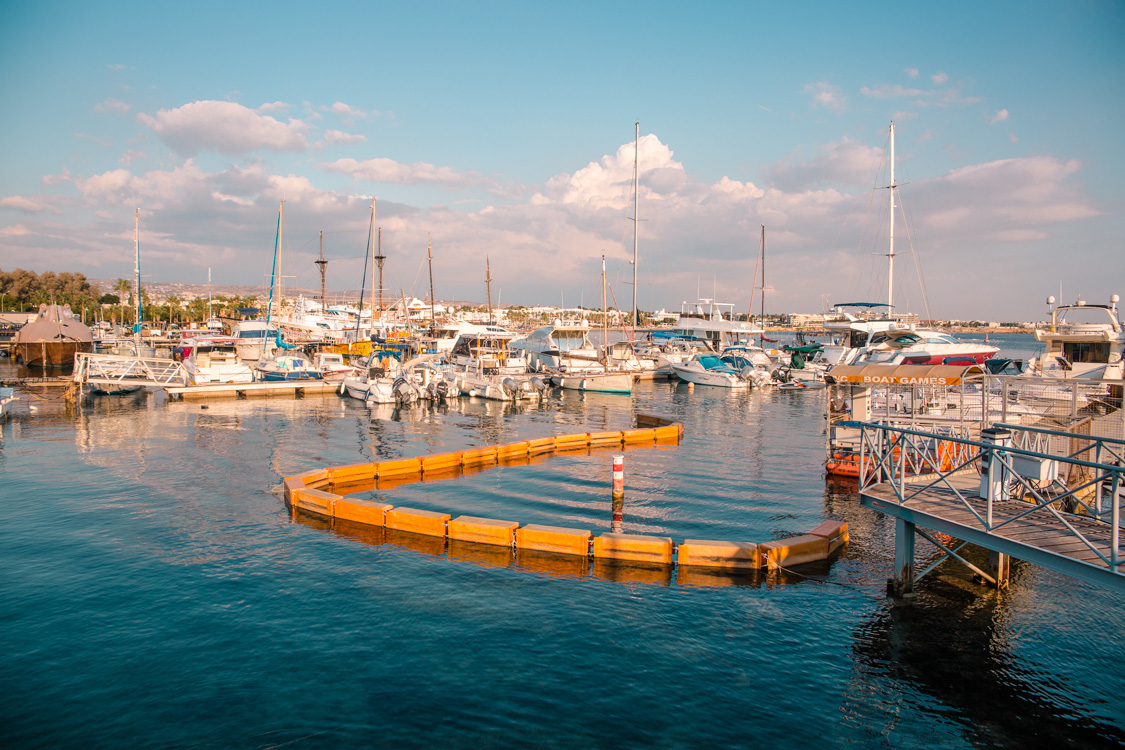 view of boats parked Paphos Harbour, Cyprus looking over towards the city